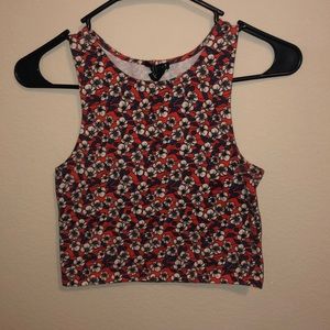 Orange crop top with white flowers and blue leaves
